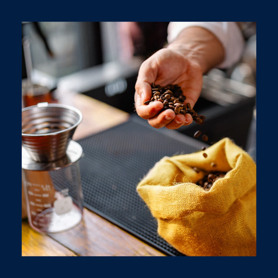 pouring coffee beans into bag