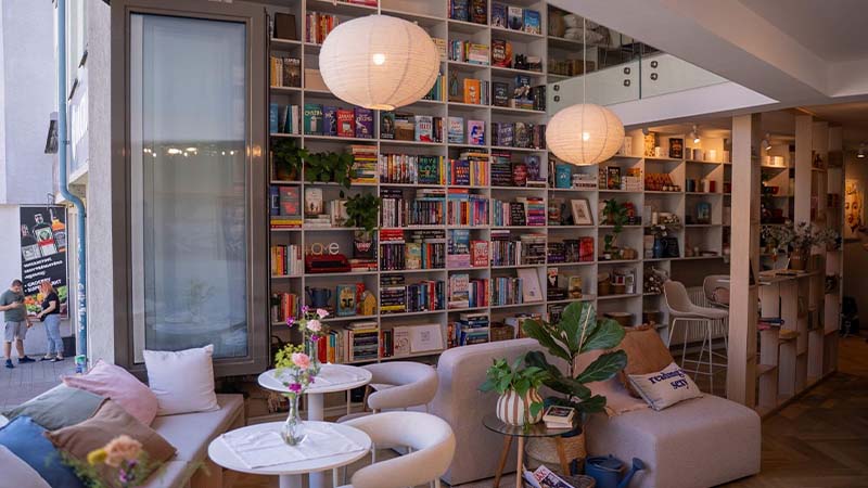 room with sofas and bookshelf